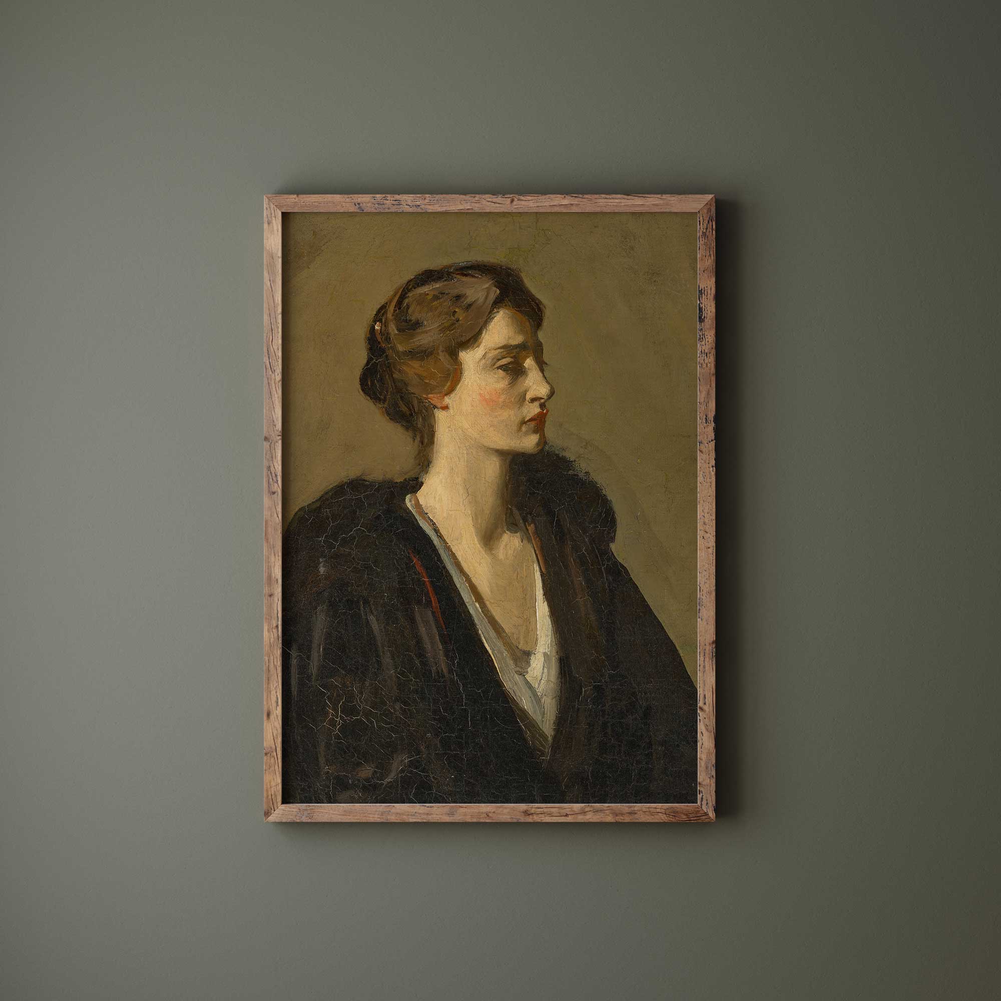 Framed portrait of a woman on a gray wall