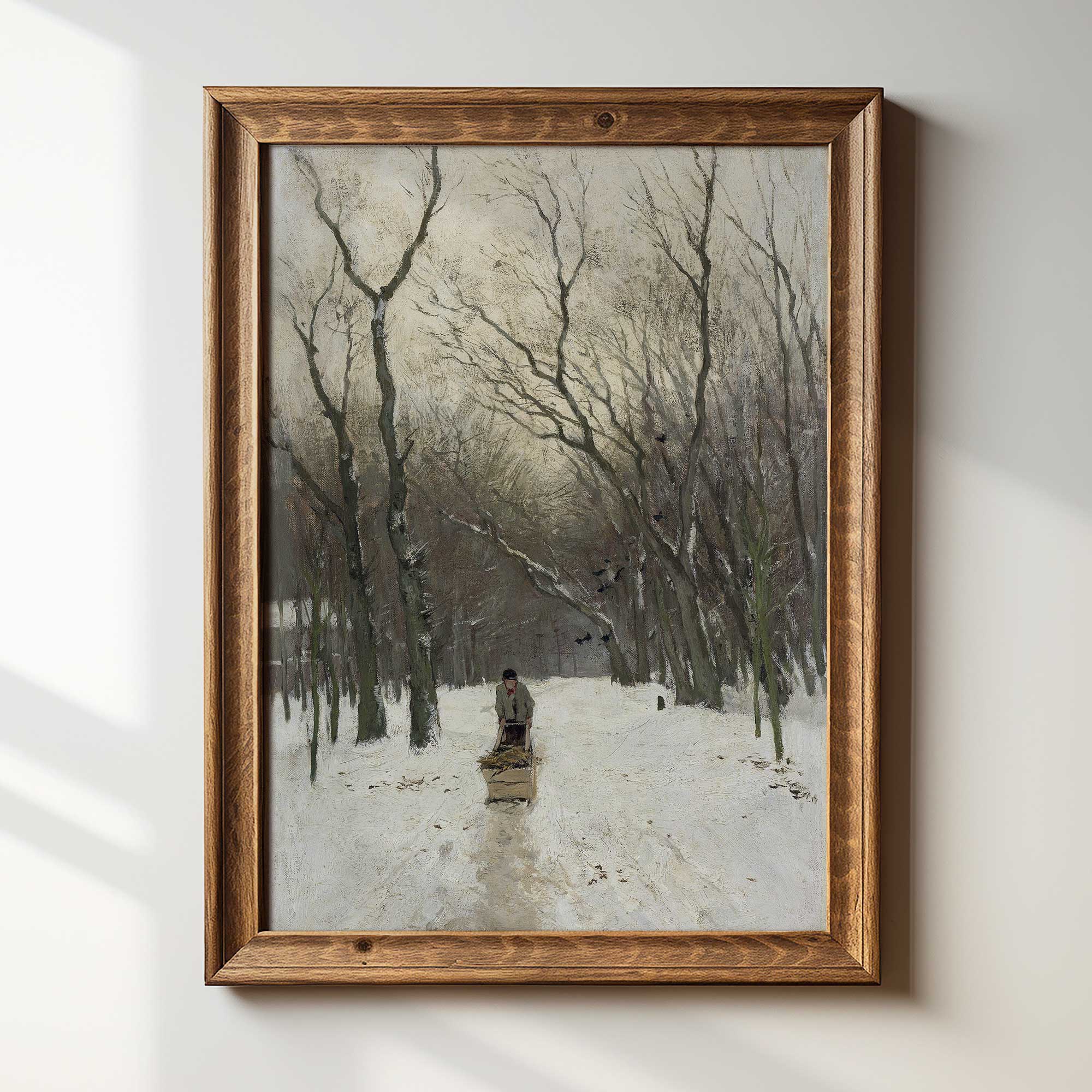 Framed artwork of a snowy landscape with a person walking.