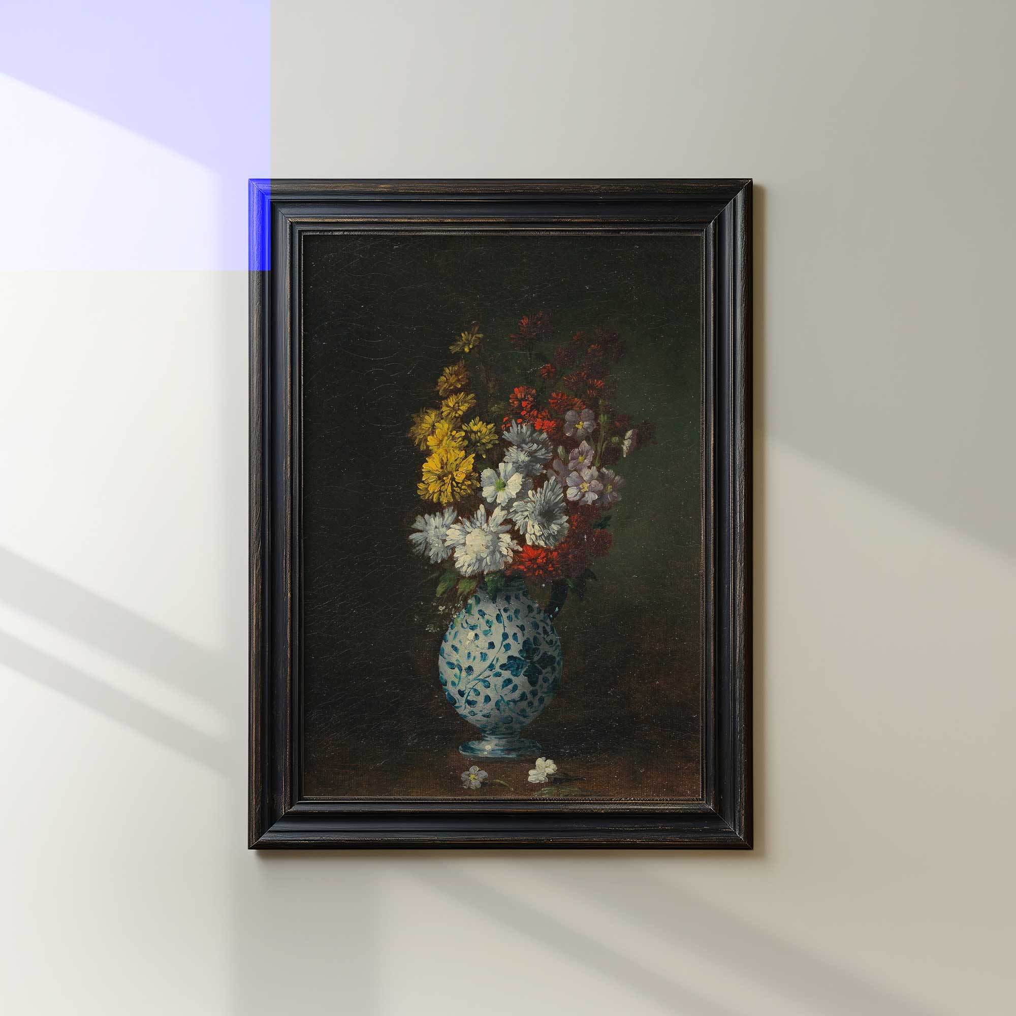 Framed painting of a vase with flowers on a wall