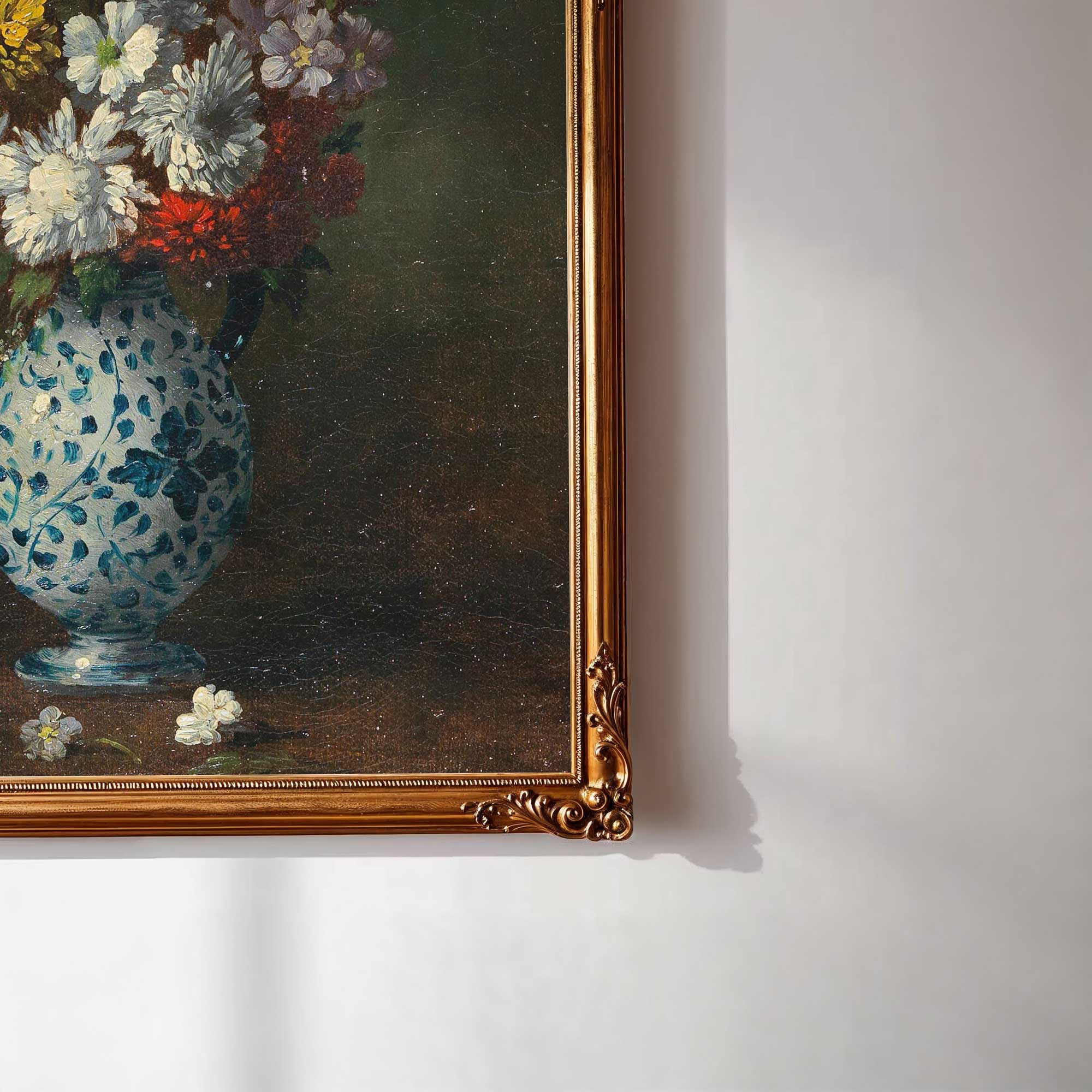 Framed painting of a floral still life with a blue vase on a white wall.