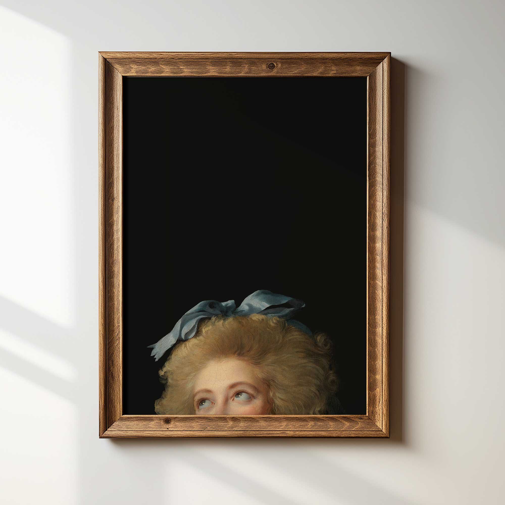 Framed Eclectic Vintage Portrait Print with a wooden frame on a white wall.