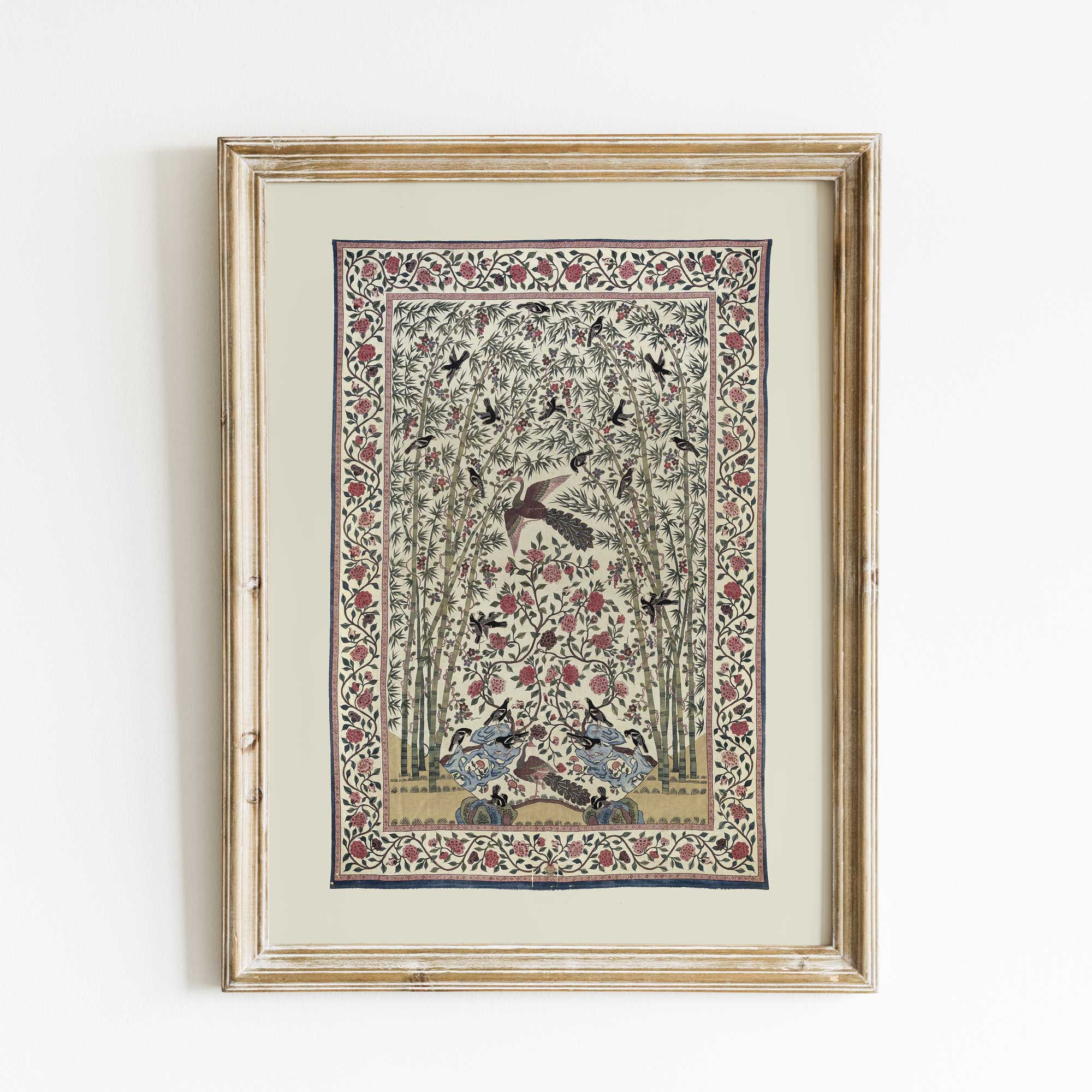 Handcrafted botanical textile print with vintage bird and floral pattern in a light wood frame.