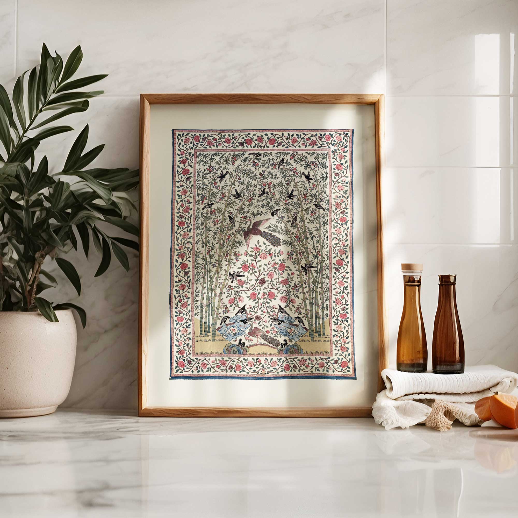 Vintage bird and floral botanical textile print on marble counter with decor.