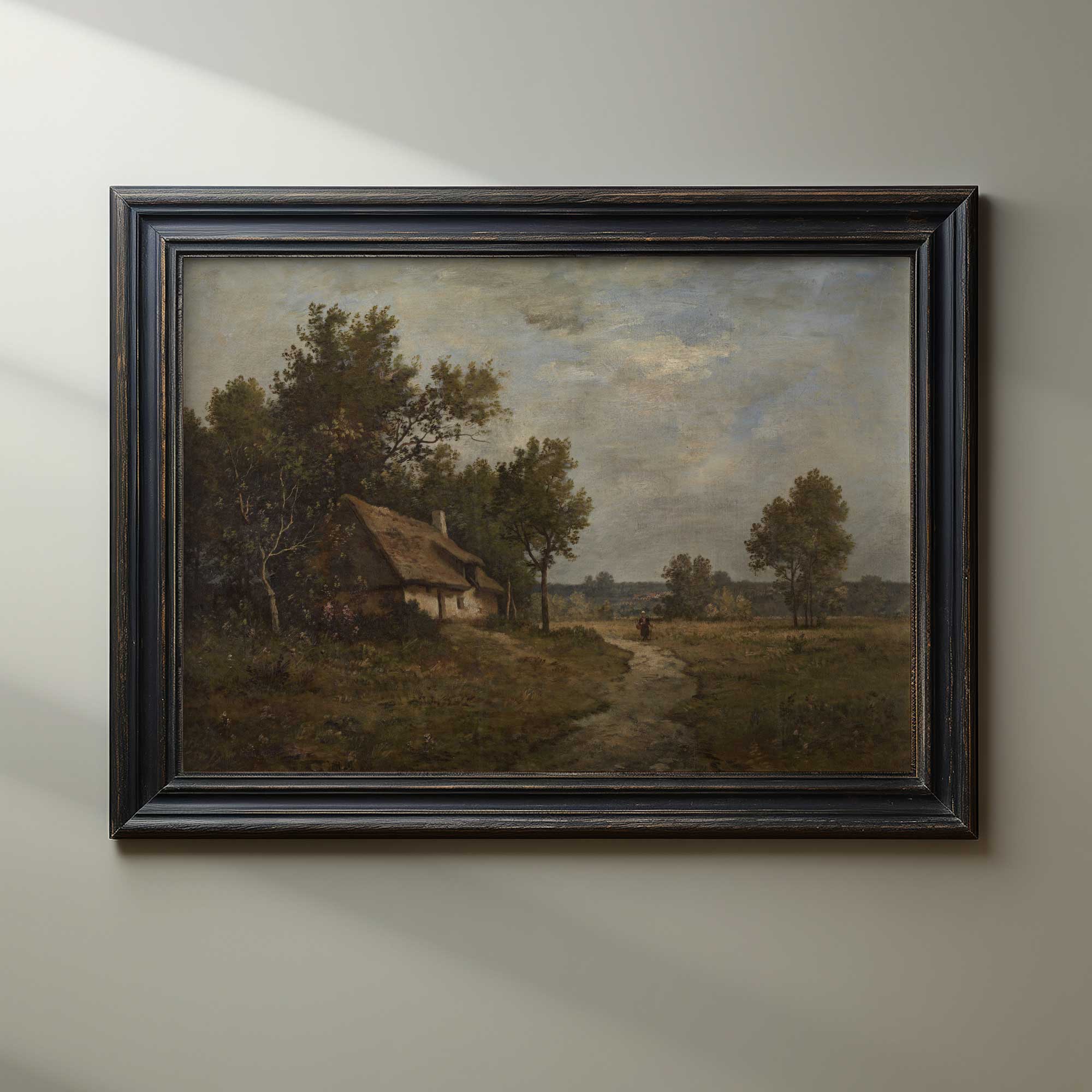 French rustic country landscape print in driftwood frame on light sage green wall — farmhouse wall art