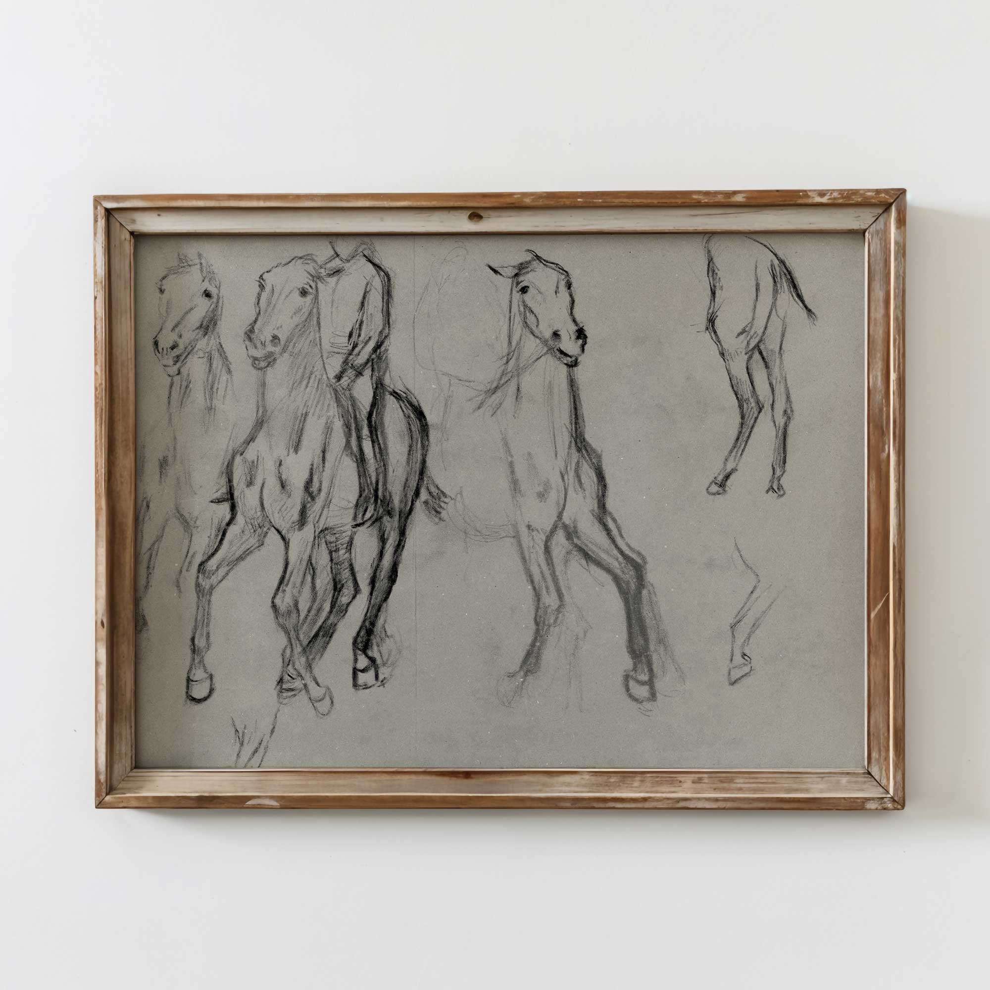 Framed drawing of horses on a white wall