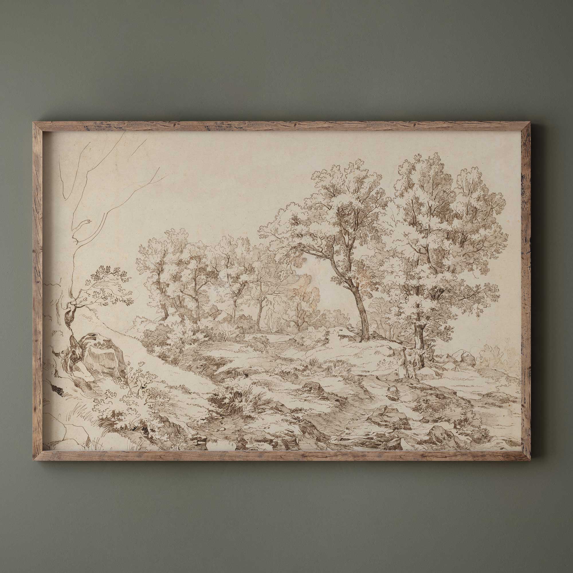 Framed landscape drawing print on a gray wall