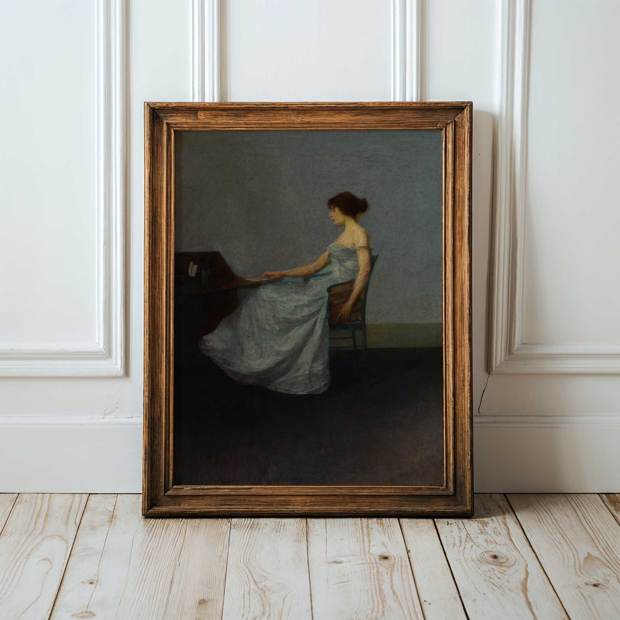 Framed painting of a woman in a blue dress sitting on a chair against a white wall.
