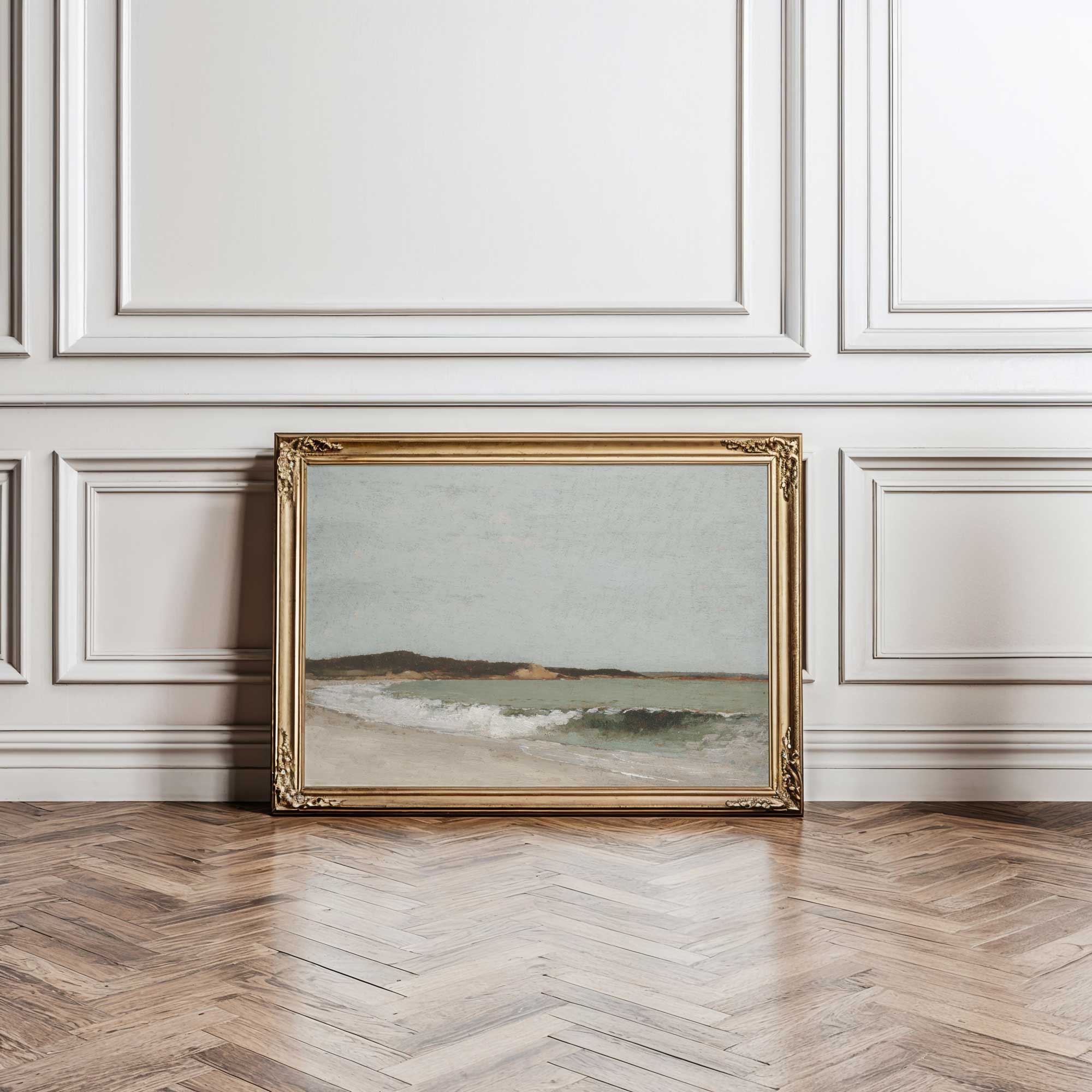 Framed seascape artwork on a wall with decorative paneling and wooden floor.