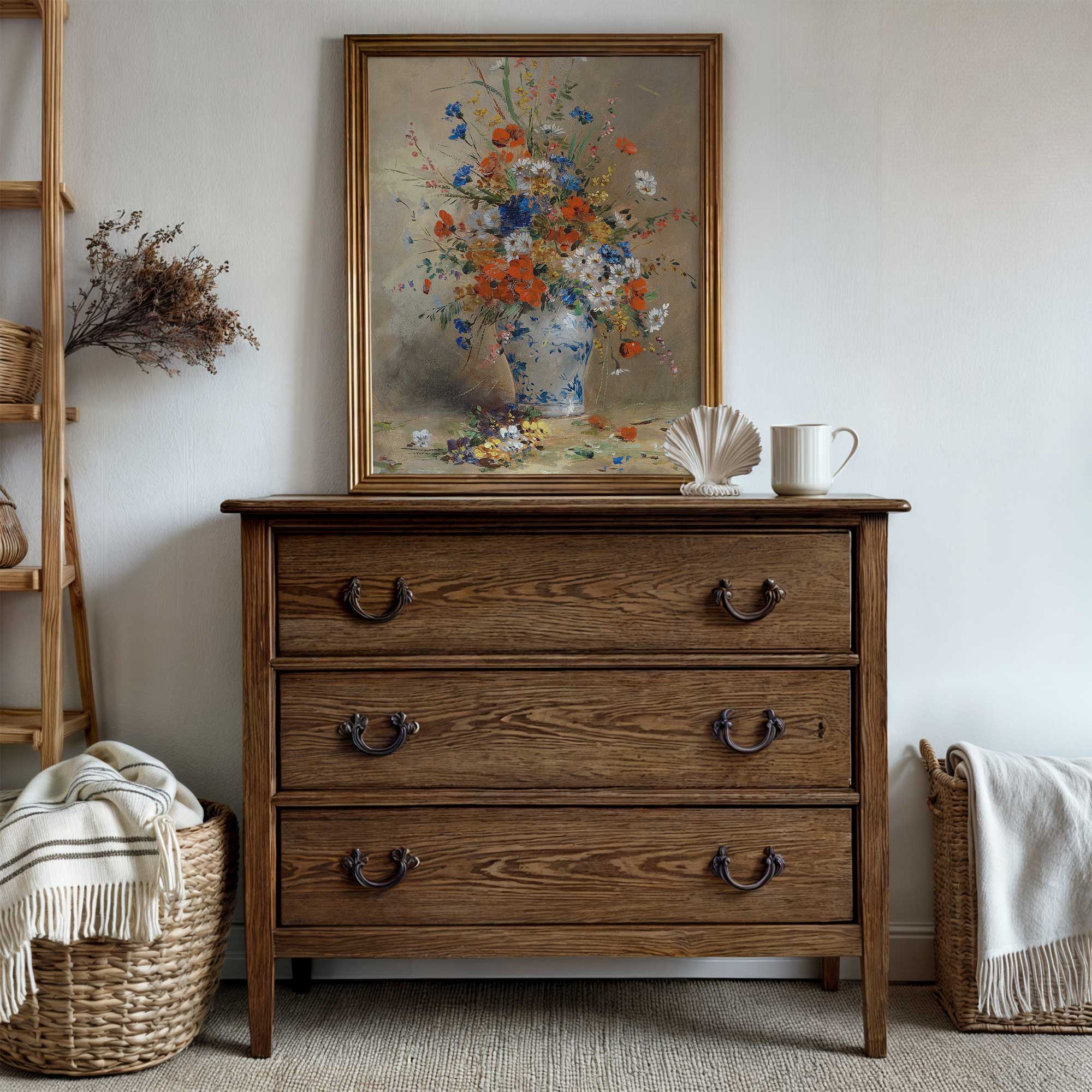 Wooden dresser with a floral painting above it in a room setting.