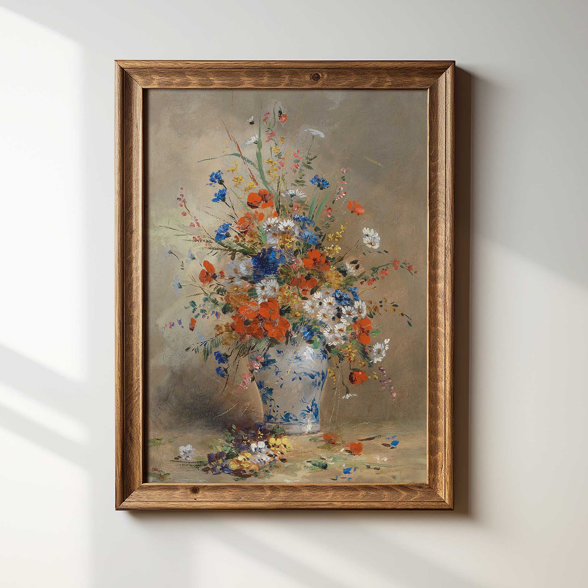 Framed painting of a bouquet of flowers on a white wall