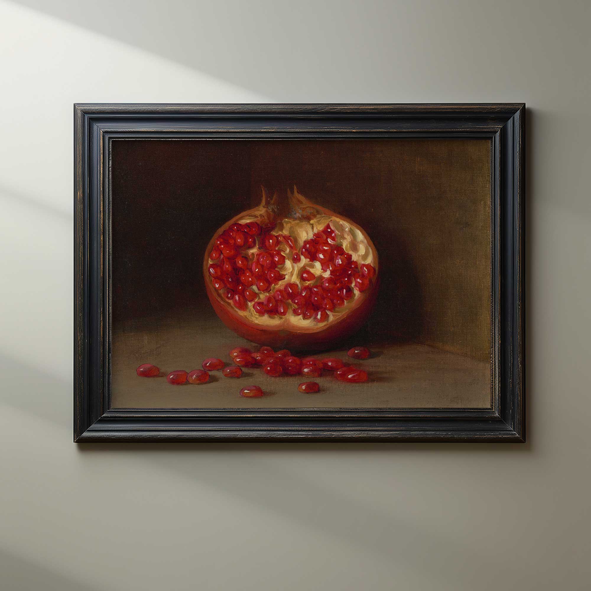 Framed painting of a pomegranate on a neutral background