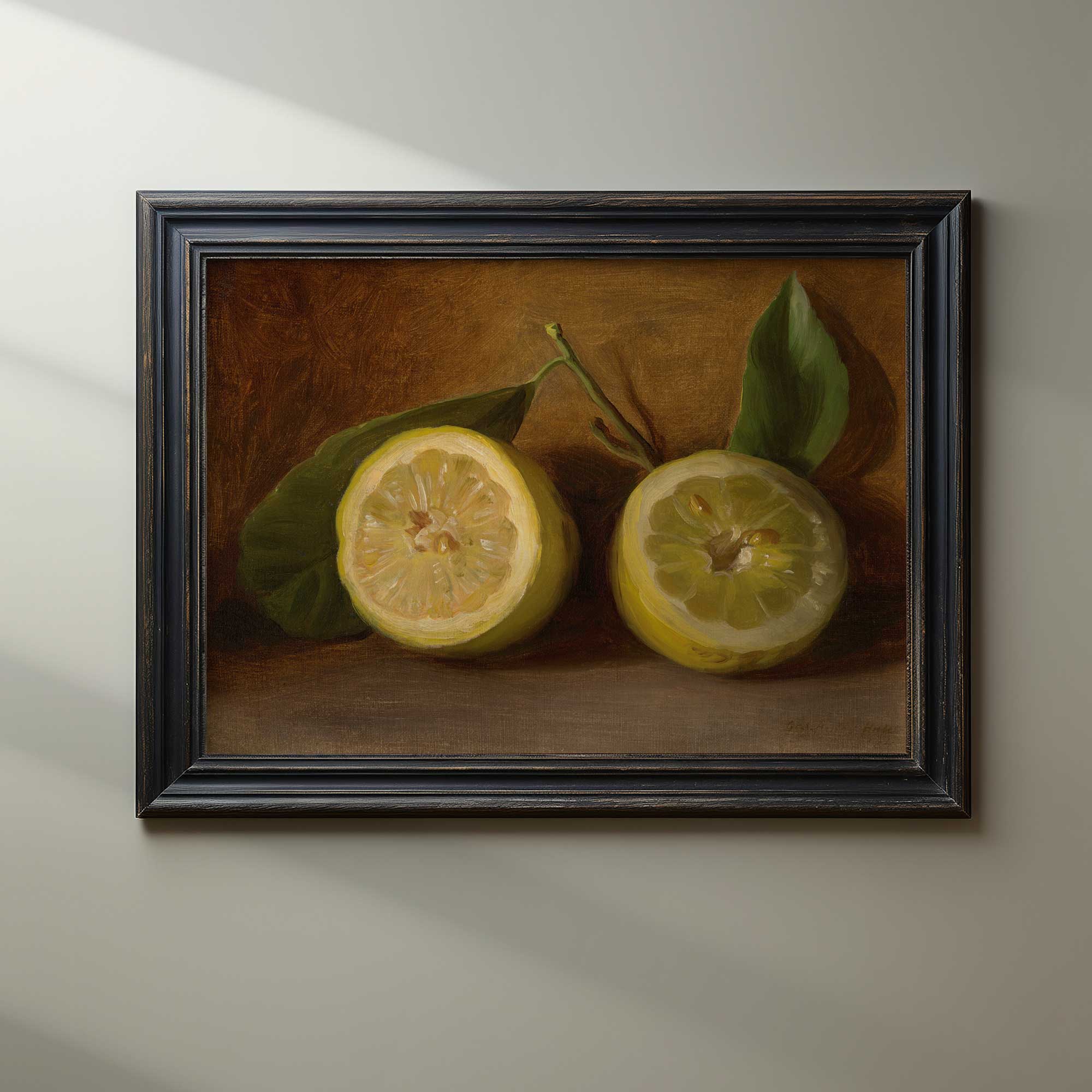 Framed painting of two lemons with leaves on a neutral background