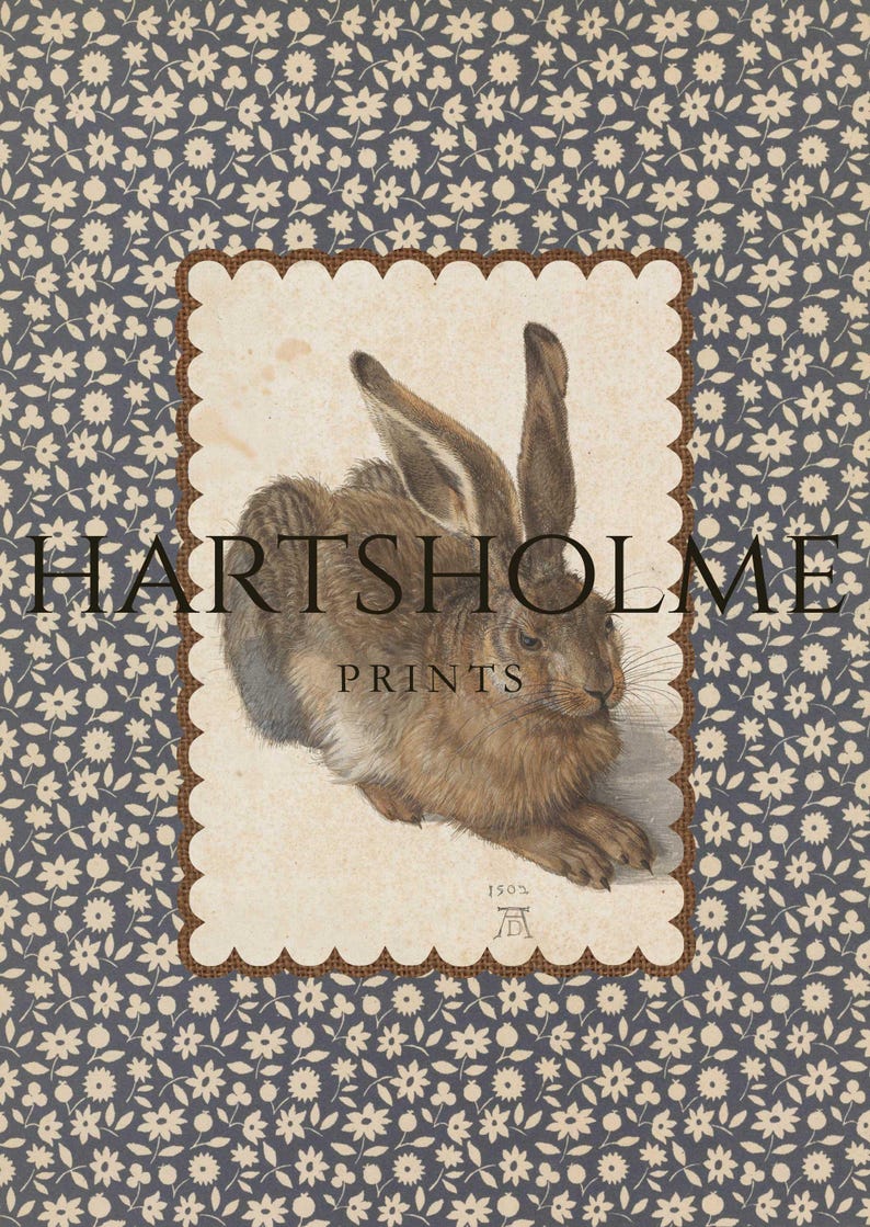 Hare wall art print with floral scalloped border in rustic farmhouse setting.