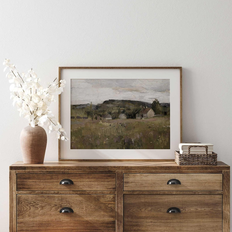 Close-up of Nordic landscape print showing cottages, meadows, and trees with soft brushstrokes.