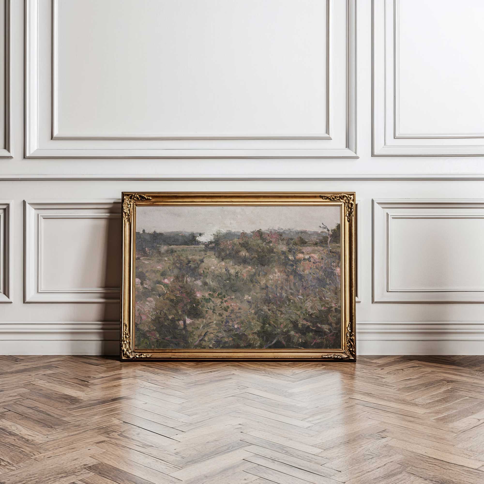 Framed French Meadow Field Landscape Print on a wall with decorative paneling and wooden floor