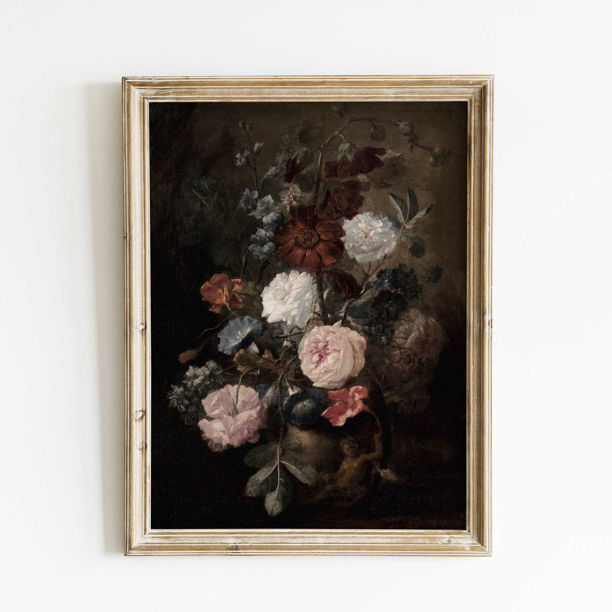 Framed painting of flowers on a white wall