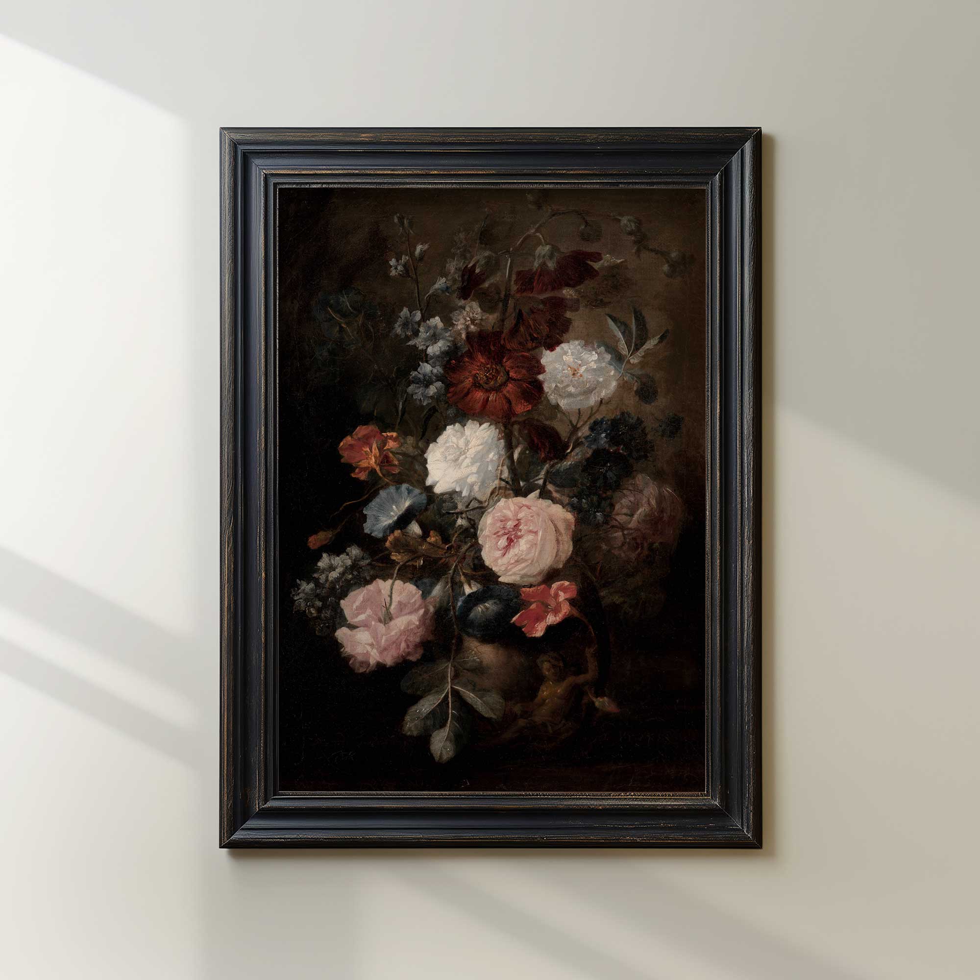 Framed painting of flowers on a white wall