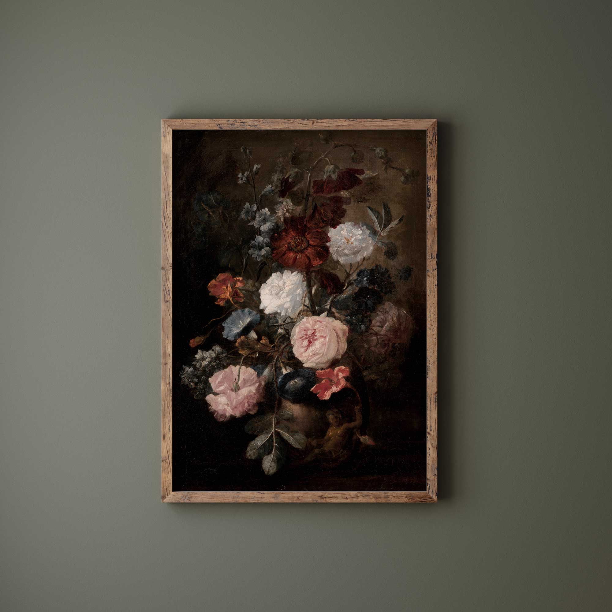 Framed painting of flowers on a dark background against a green wall