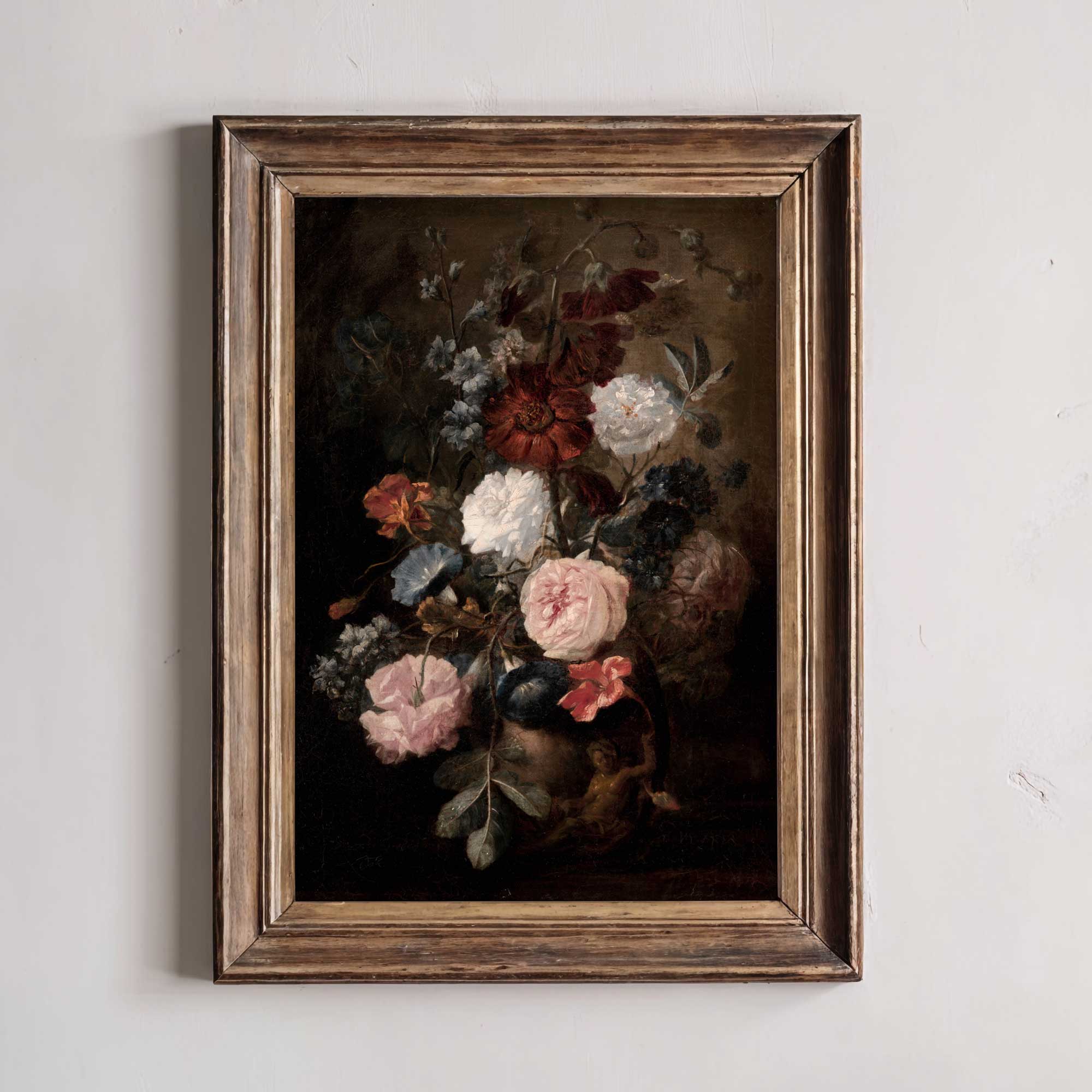 Framed painting of a bouquet of flowers on a white wall