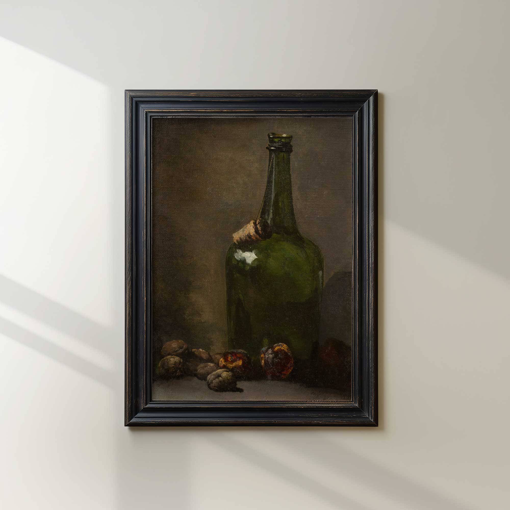 Framed painting of a still life with a green bottle on a white wall