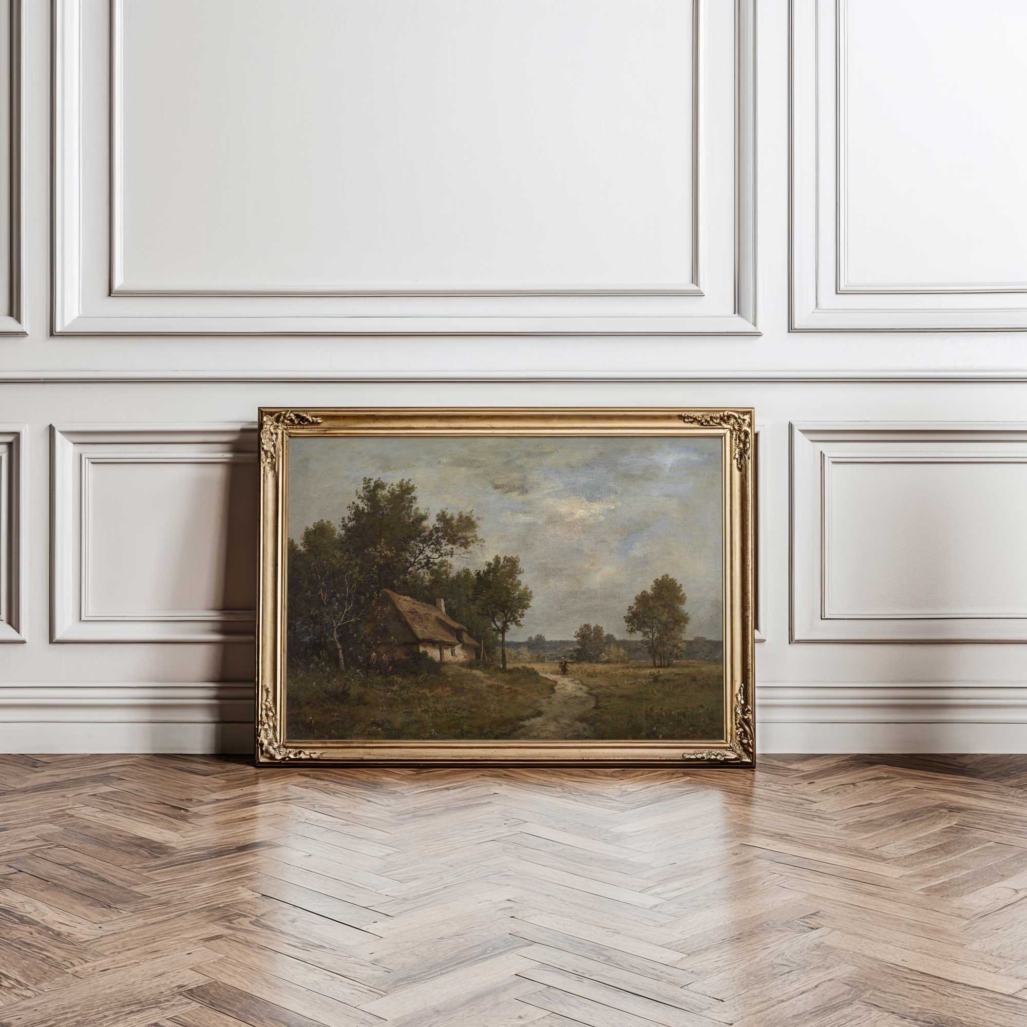 Gold ornate frame — The Thatched Cottage Path vintage landscape print in ornate gold frame leaning against white panelled wall