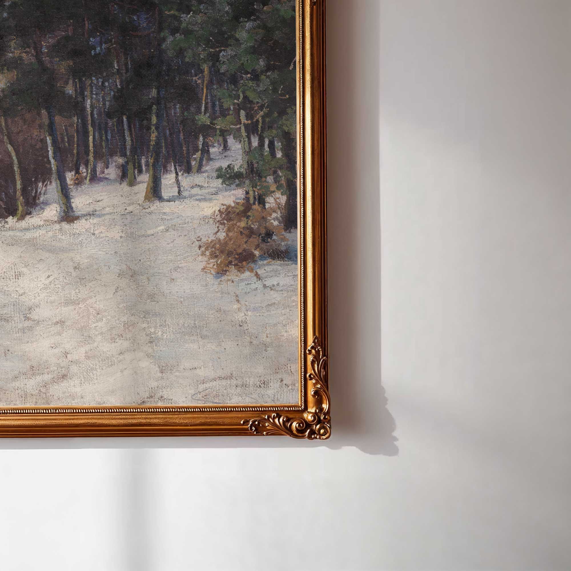 Framed painting of a snowy landscape with trees on a white wall