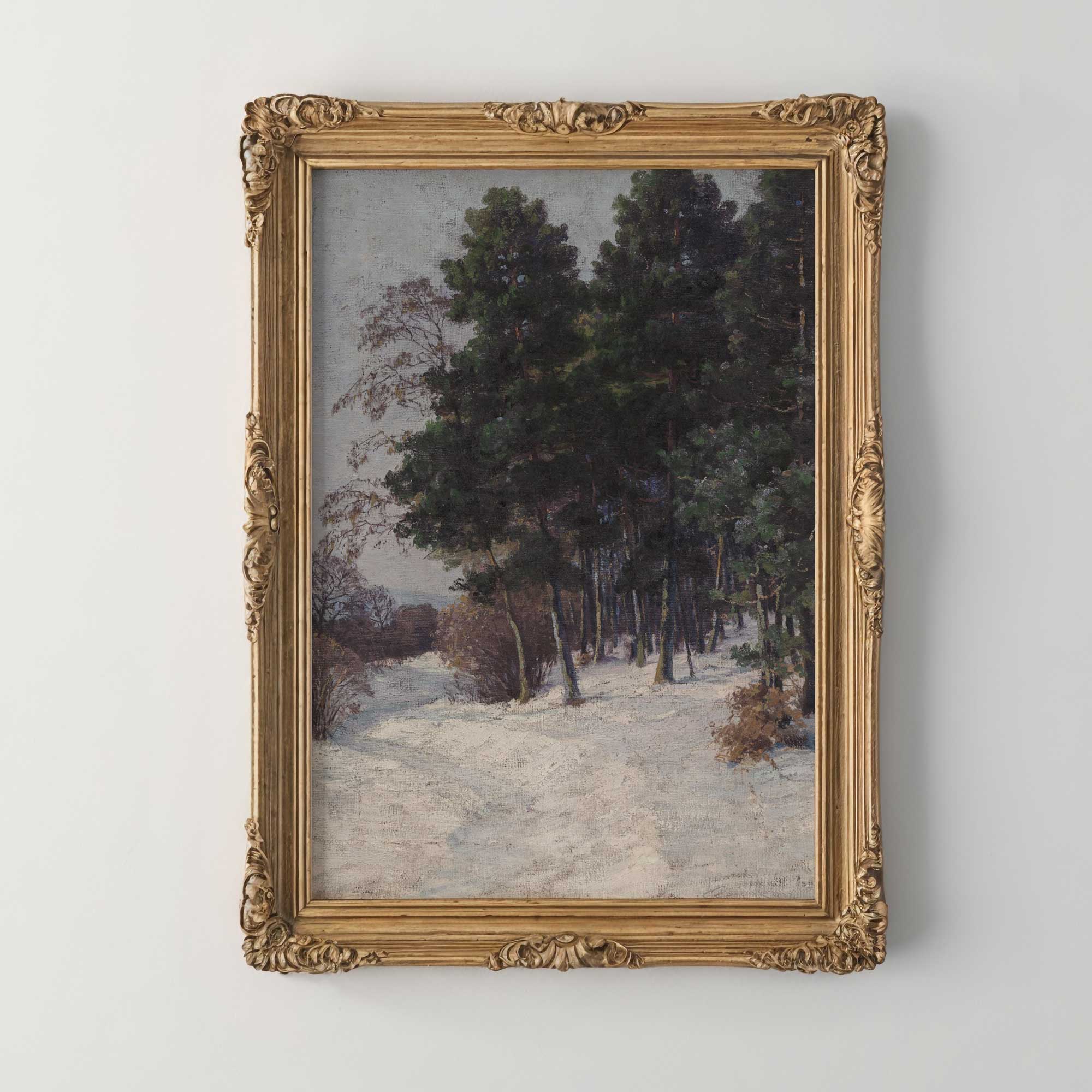 Framed painting of a snowy landscape with trees on a white wall