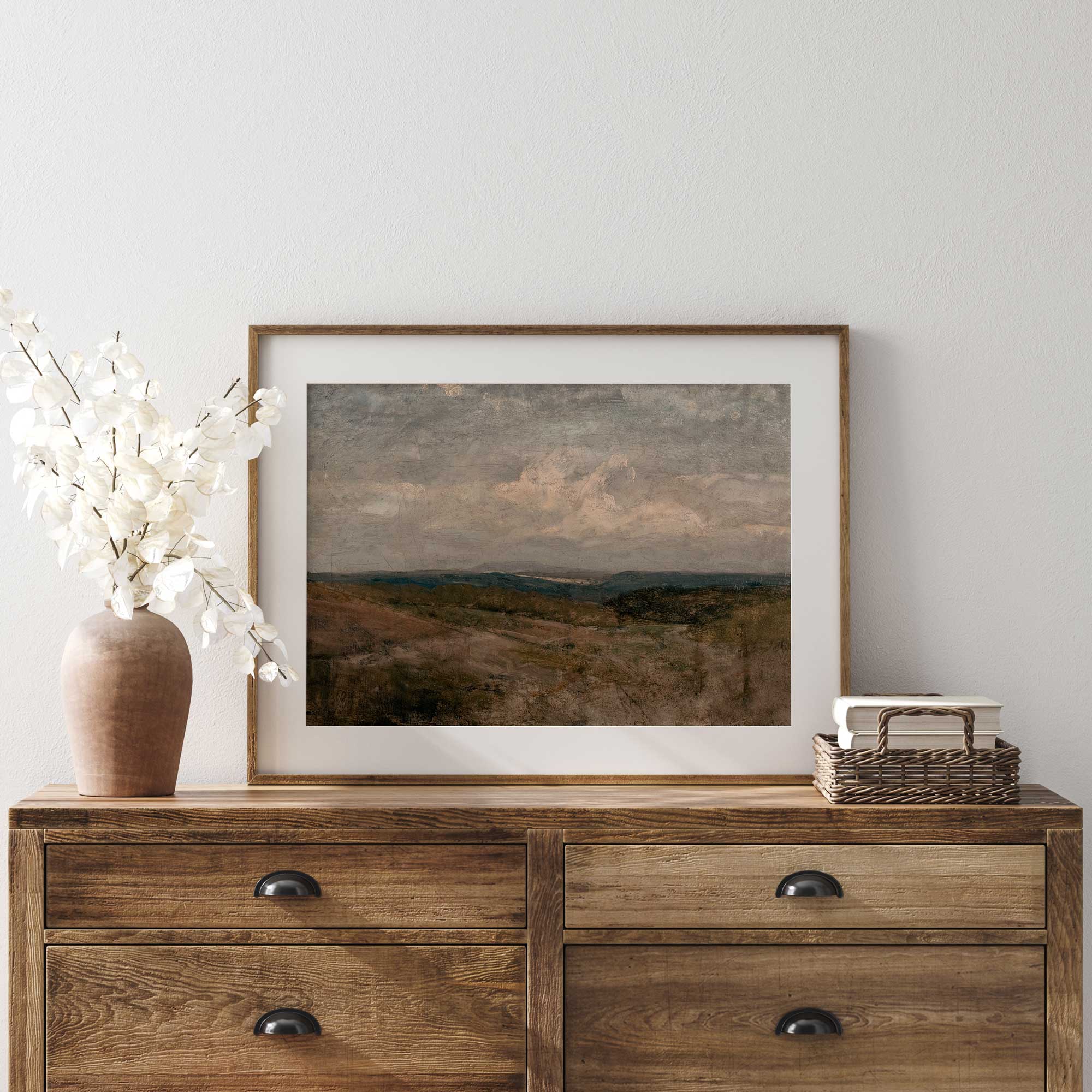 Moody countryside landscape under cloudy sky