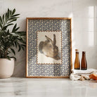 Decorative rabbit wall print in a warm cottage-style setting.