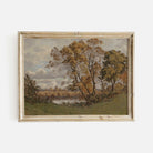 Framed autumn vintage landscape print  of trees by a lake on a white wall