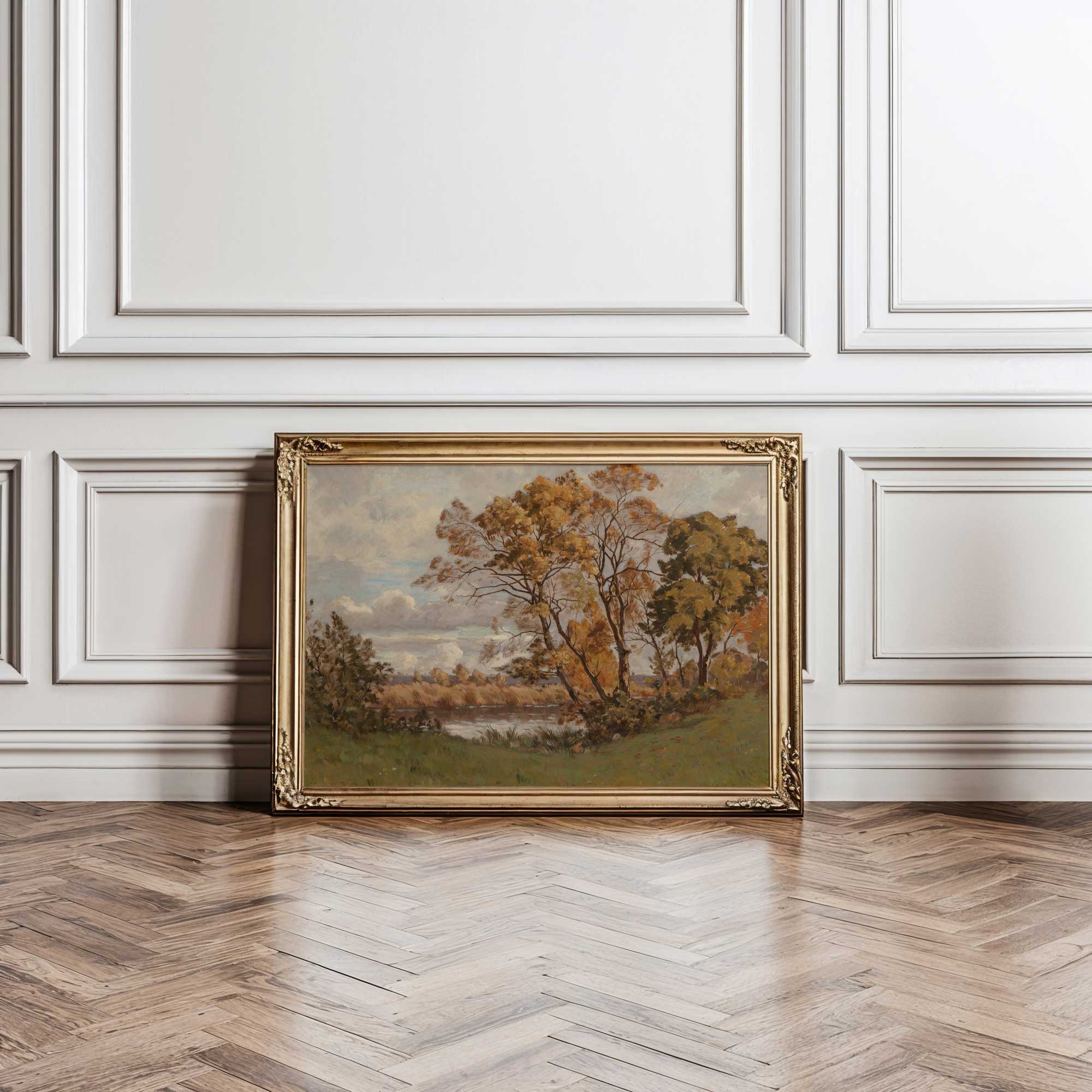 Framed autumn vintage landscape print on a wall with wooden floor