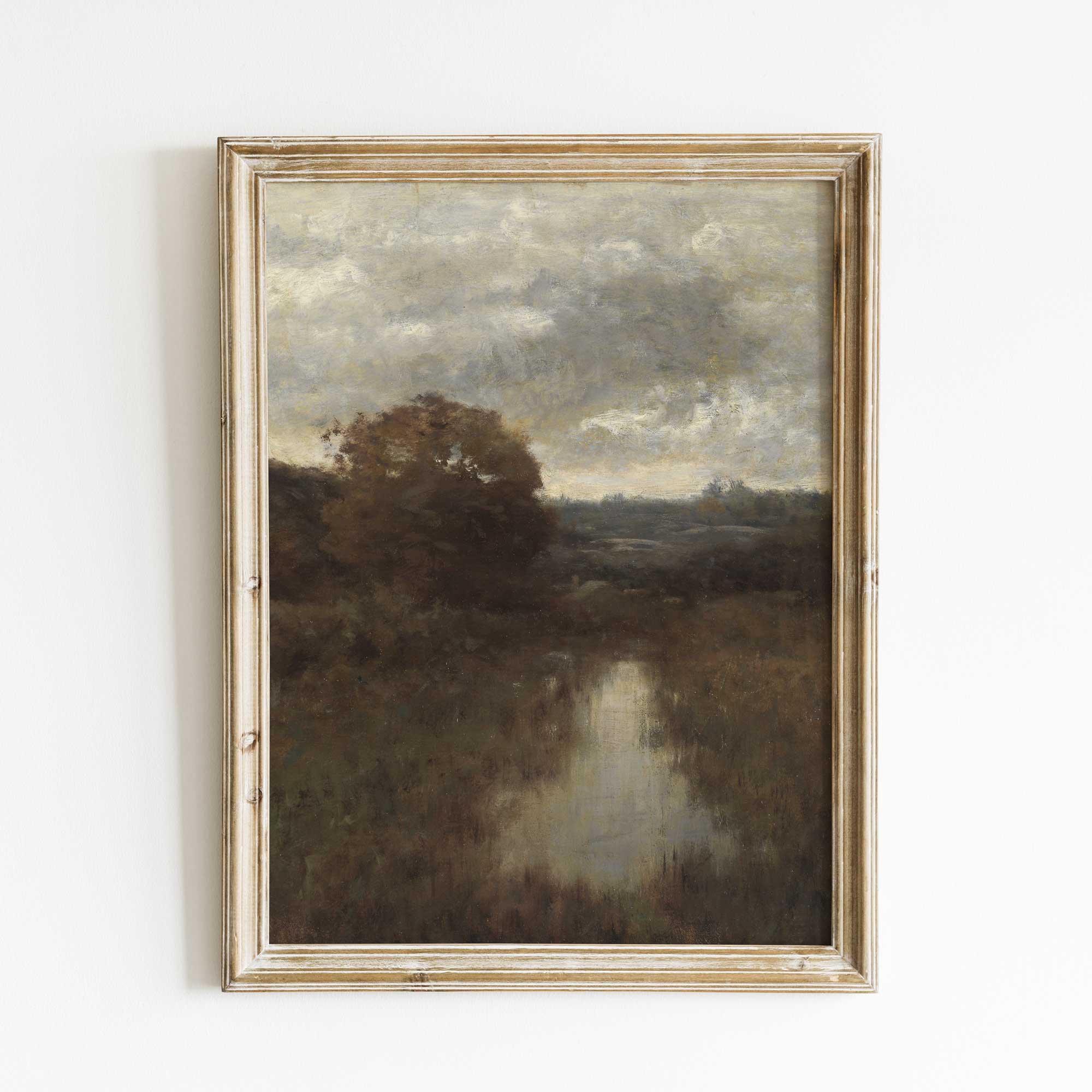 Framed Moody Vintage Landscape Print on a white wall.