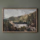 Framed painting of a Vintage Estate with a building and trees on a green wall.