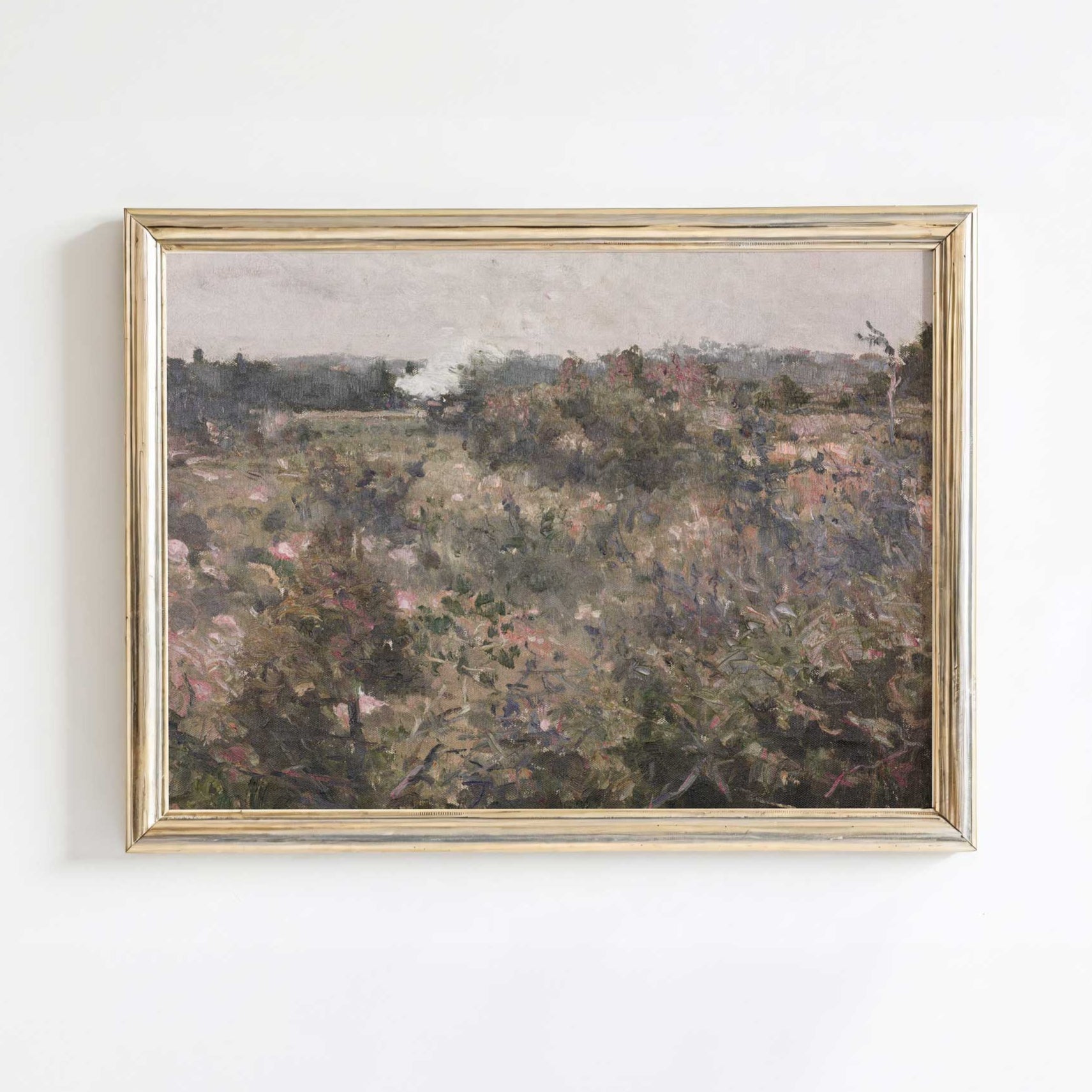 Rustic countryside wall art displayed on a wooden cabinet, featuring a French meadow field print.