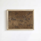 Framed artwork of horses on a white wall