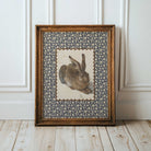 Antique-style rabbit wall art in a cozy country home.
