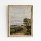 Framed vintage landscape painting print with a path and trees on a white wall