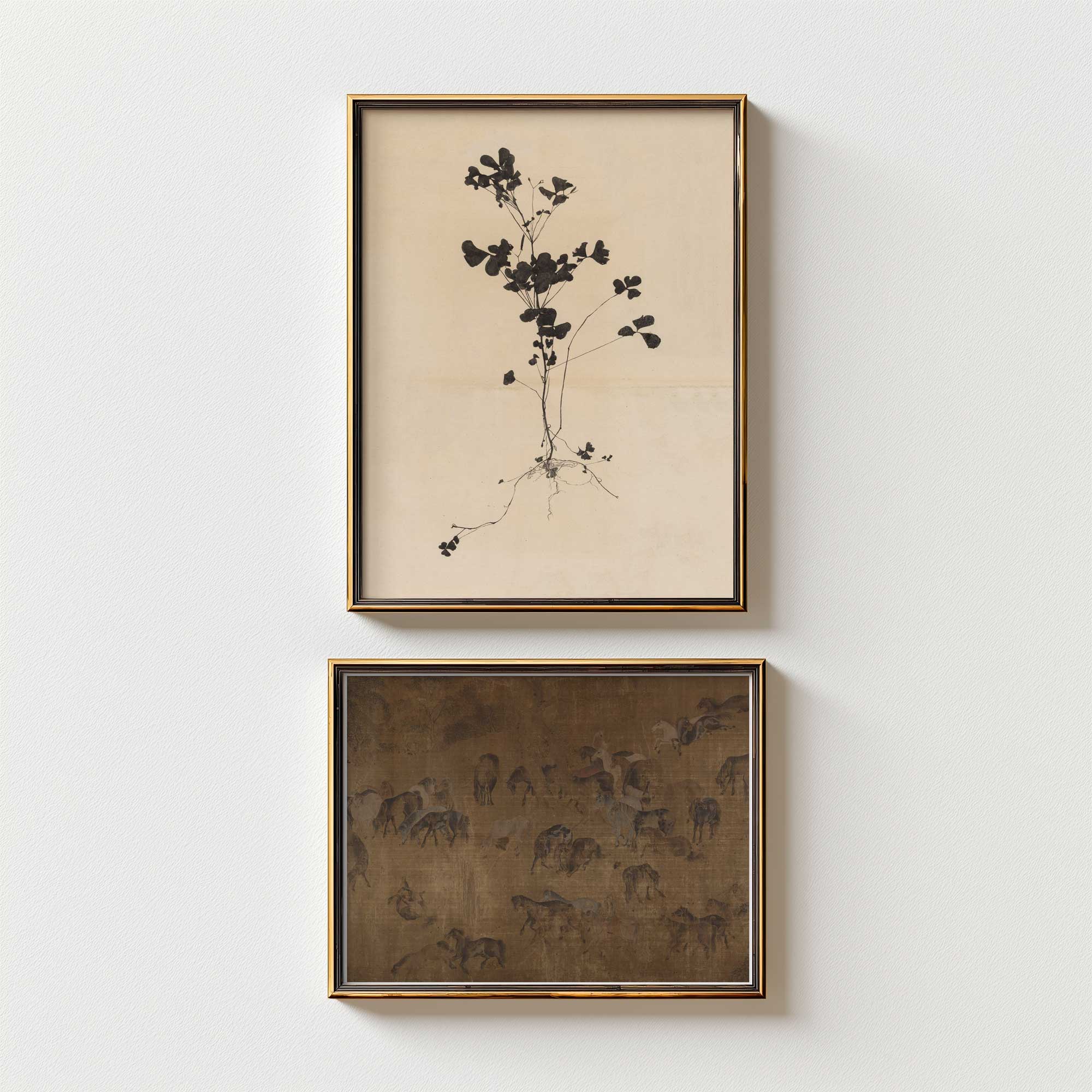 Two framed artworks on a white wall, one with botanical design and the other with The Hundred Horses in Moody dark tones