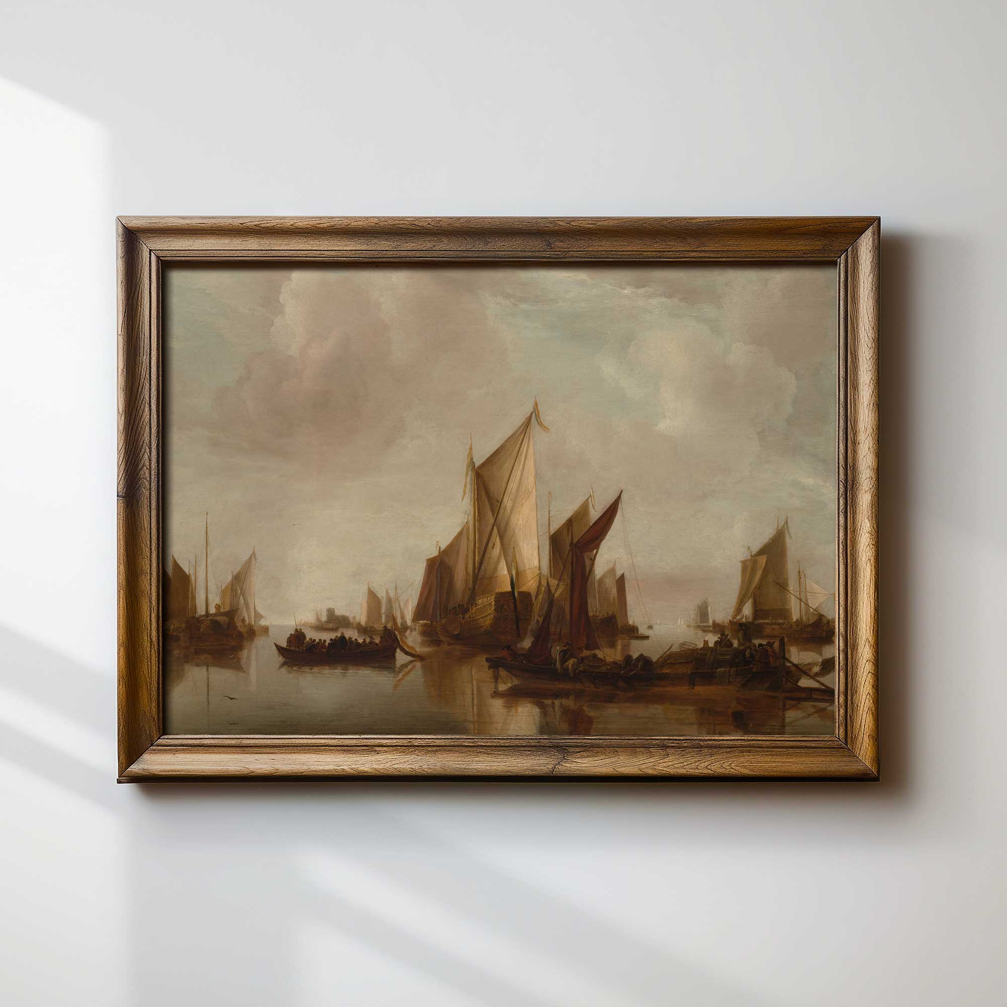 Framed painting of sailboats on a body of water against a cloudy sky.