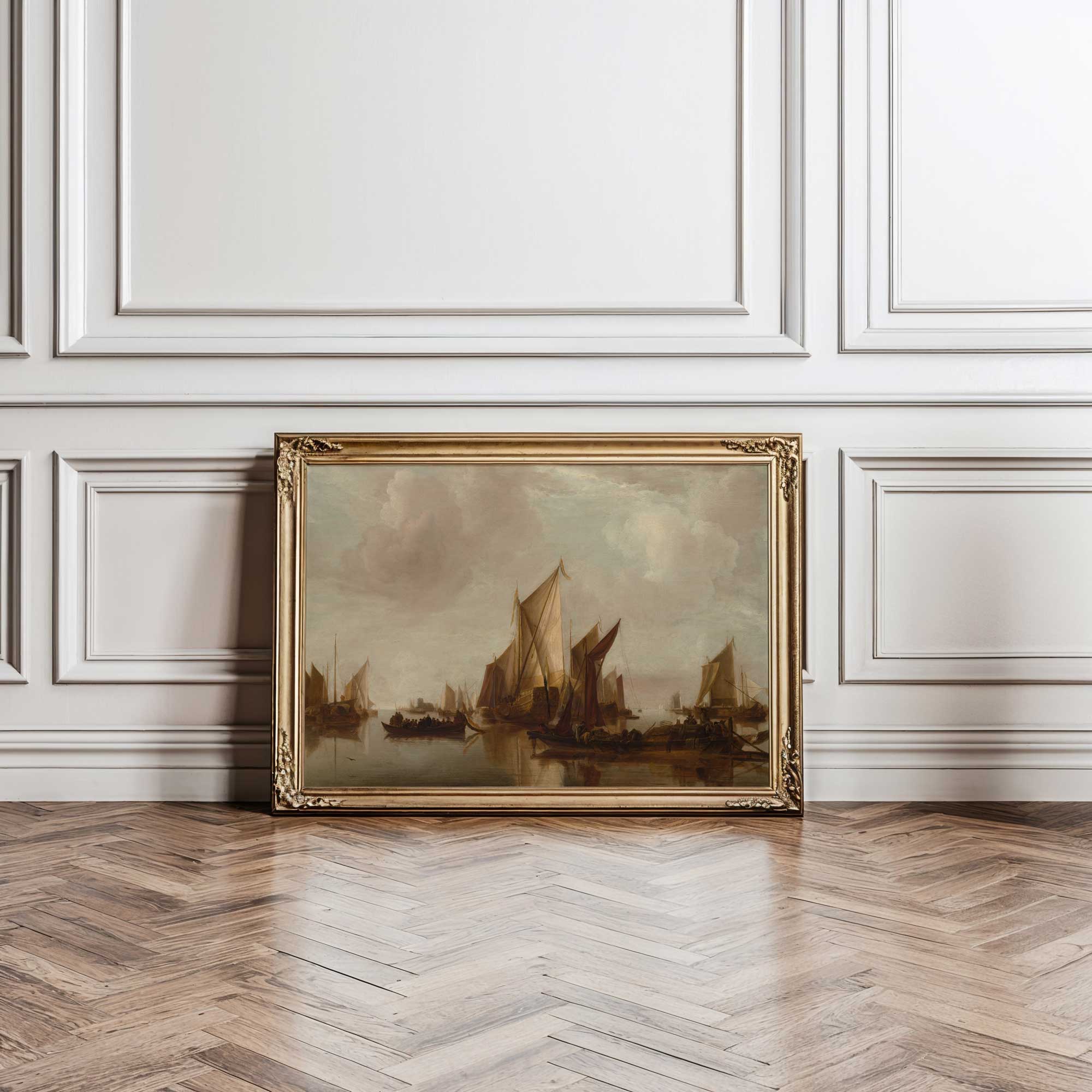 Framed painting of sailboats on a wall with wooden floor