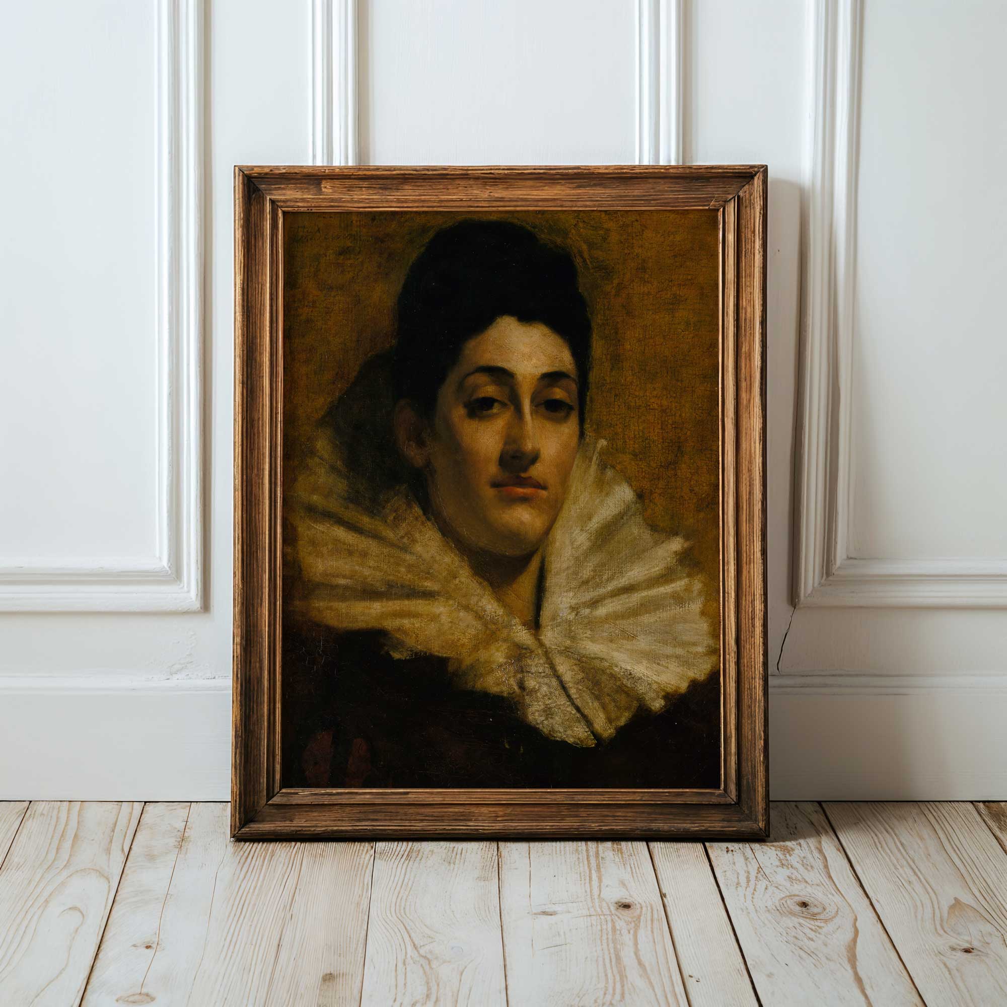Framed dark oil portrait of a woman with a large ruffled collar on a wooden floor against a white panelled wall.