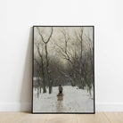 Framed artwork of a snowy landscape with trees and a person walking.