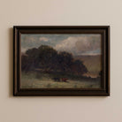 Moody farmhouse landscape print with grazing cattle in a rural meadow displayed in dark brown wood frame