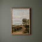 Vintage country landscape print in driftwood frame on sage green wall — farmhouse wall art