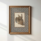 Rustic wooden frame showcasing a vintage rabbit print.