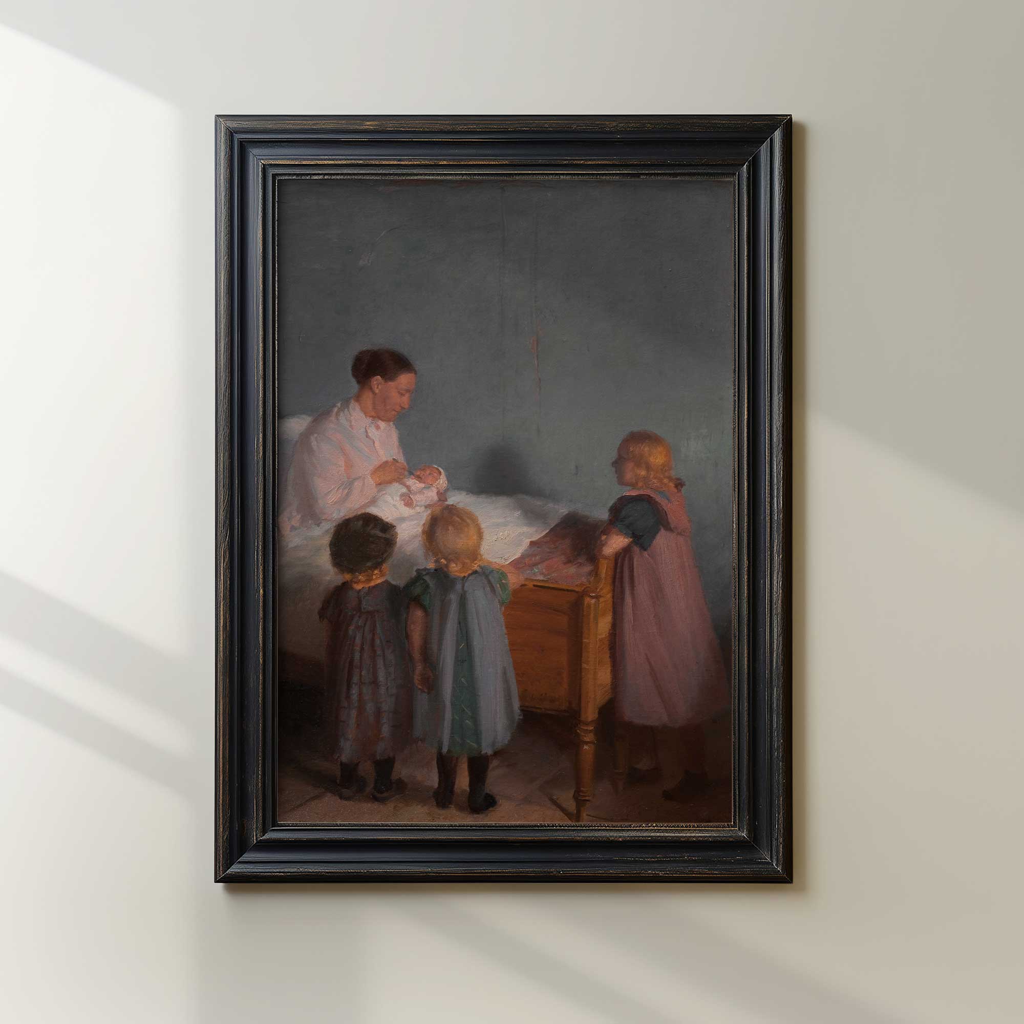 Antique family scene wall art featuring a mother cradling her newborn while children gather nearby