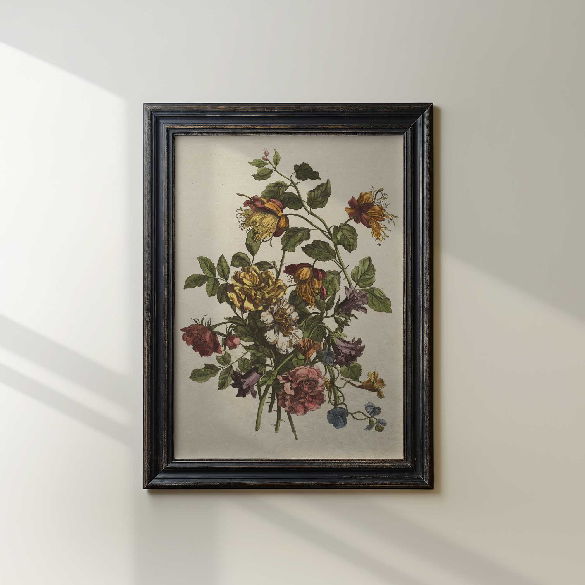Framed botanical print of flowers on a white wall