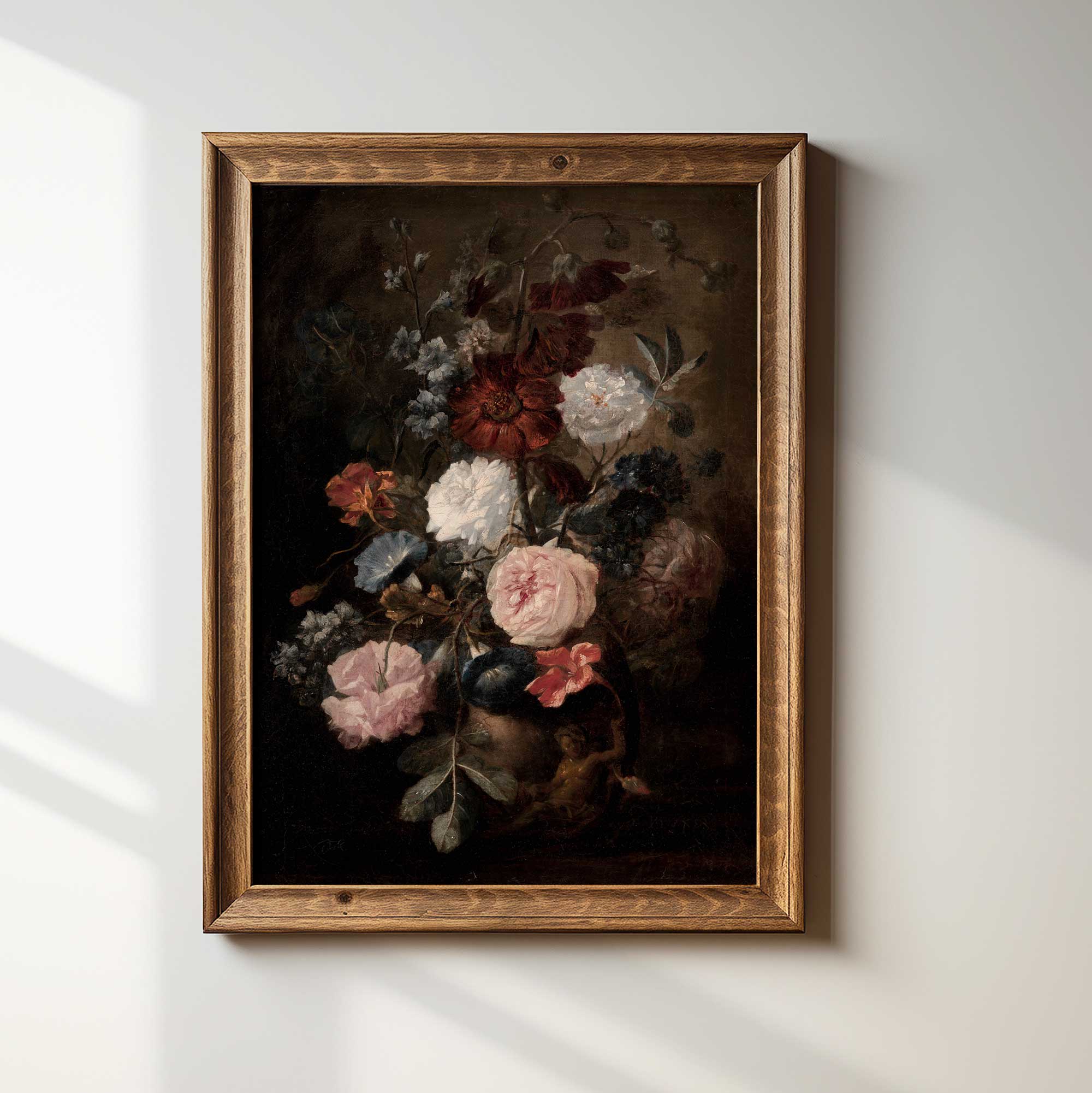 Framed painting of flowers on a white wall