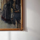 Close-up detail of vintage kitchen scene print showing woman cooking beside a farmhouse stove