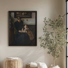 Vintage mother and child reading print displayed in a neutral farmhouse living room with black frame